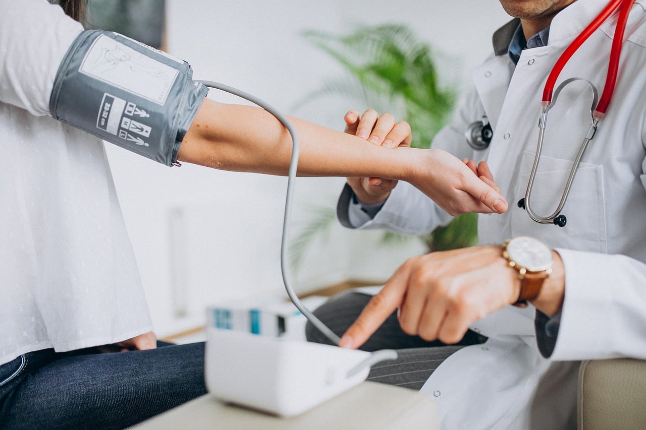 Physician examining a patient in a bright, calm medical office
