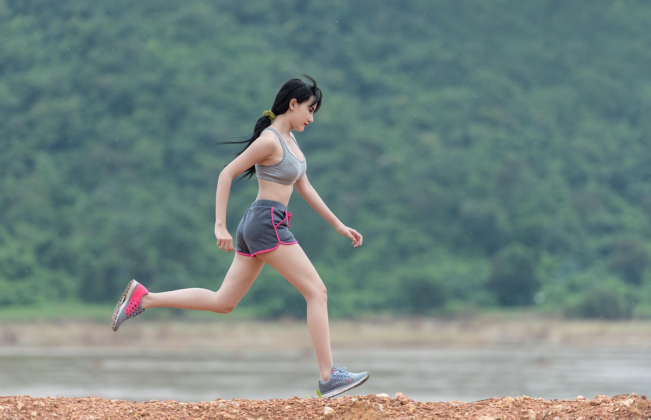 Runner training on a coastal path in the morning light
